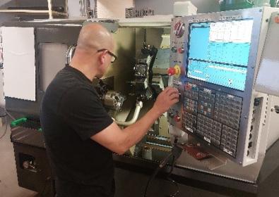 A person operating a machine.